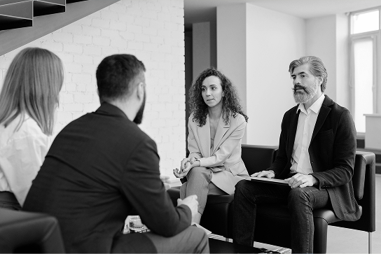 Startup founders reviewing grant documents together